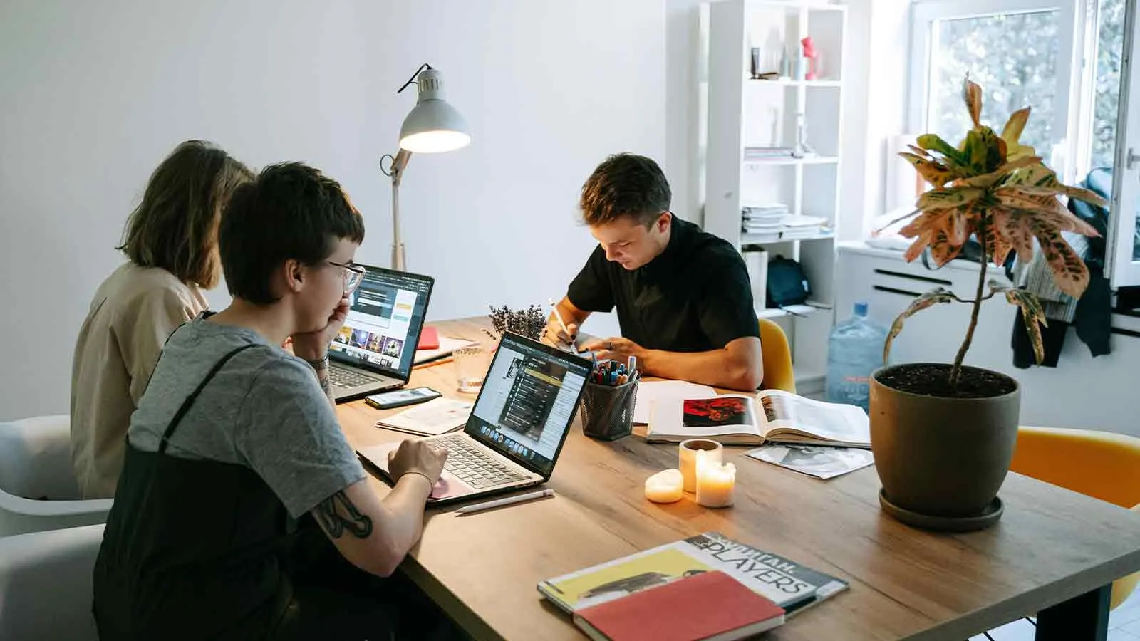 Legal team cross-checking a vendor title report for red flags at a shared desk
