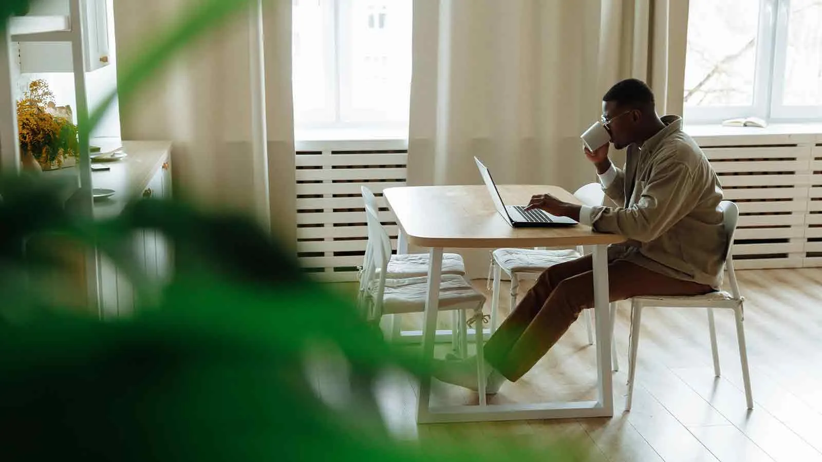 Buyer reviewing earnest money deposit terms on a laptop at home