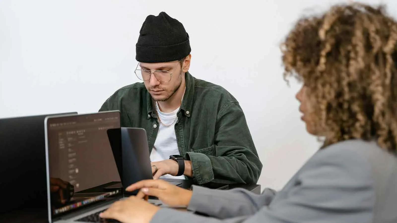 Researcher running an address lookup on a laptop to pull property records