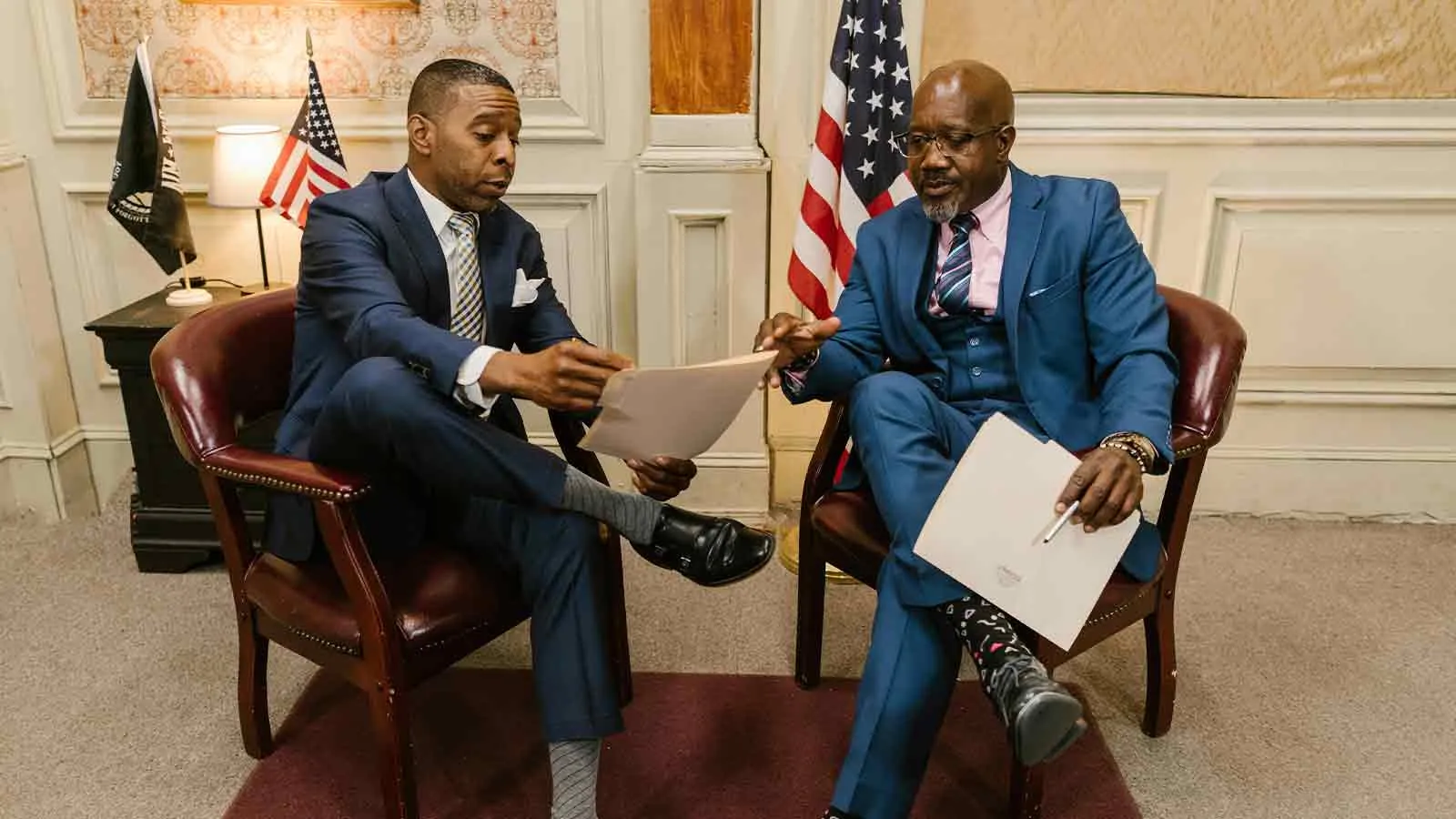 Two attorneys reviewing delegated title work as part of due diligence