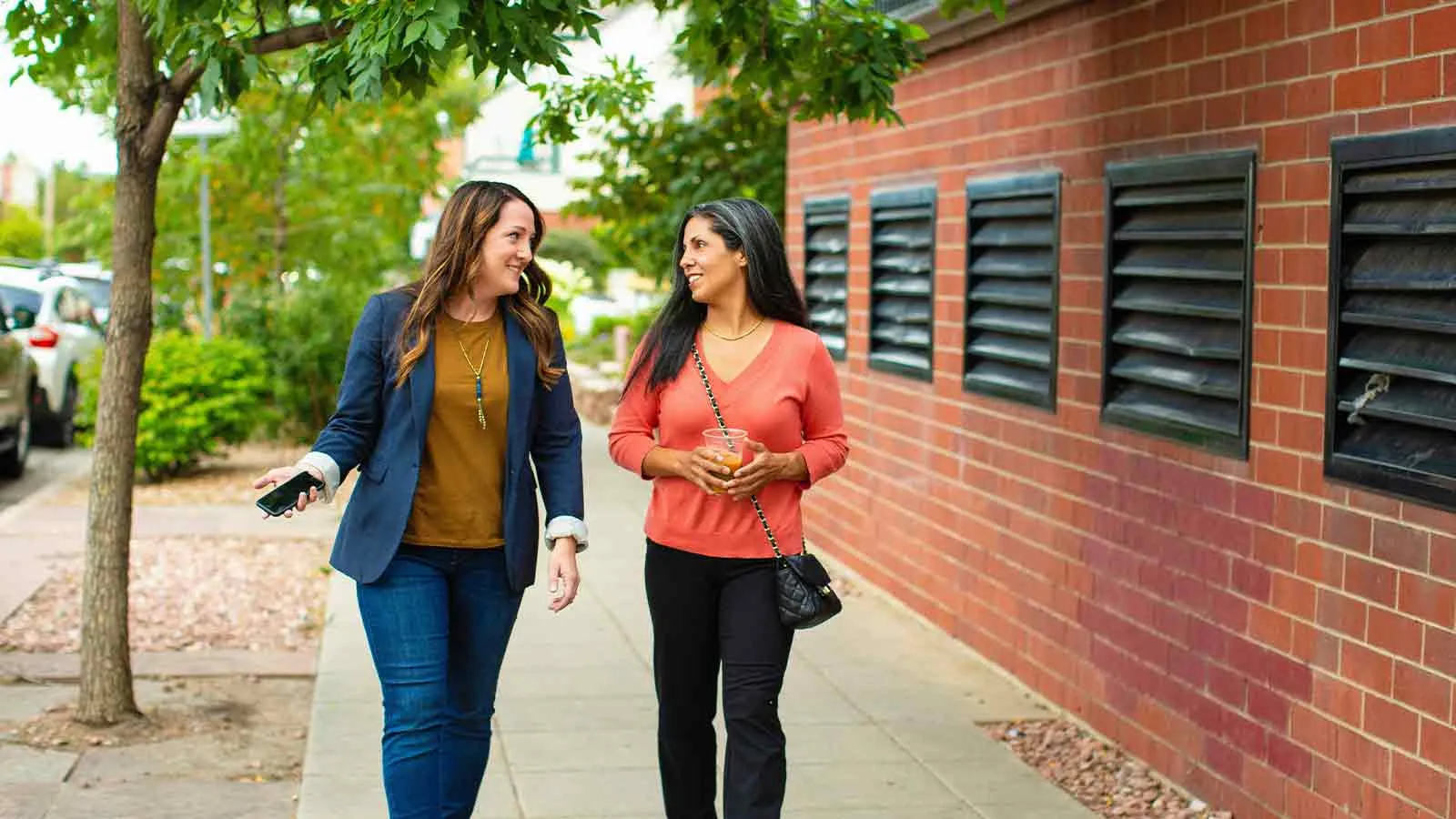Buyer and agent walking to sign paperwork after opening escrow