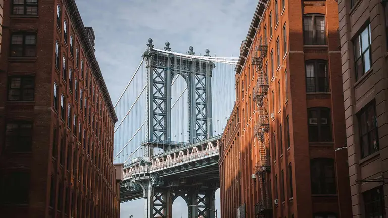 Manhattan Bridge over a DUMBO street, where an ECB violation search protects NYC buyers