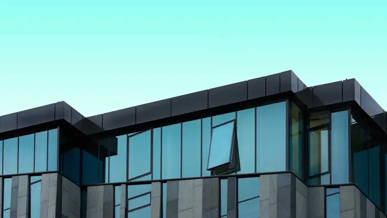Glass office building where encumbrance certificate records are examined