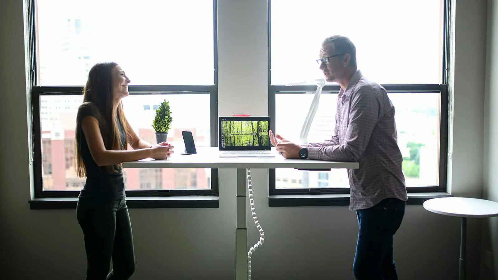 Researchers comparing lienholder records at a standing table