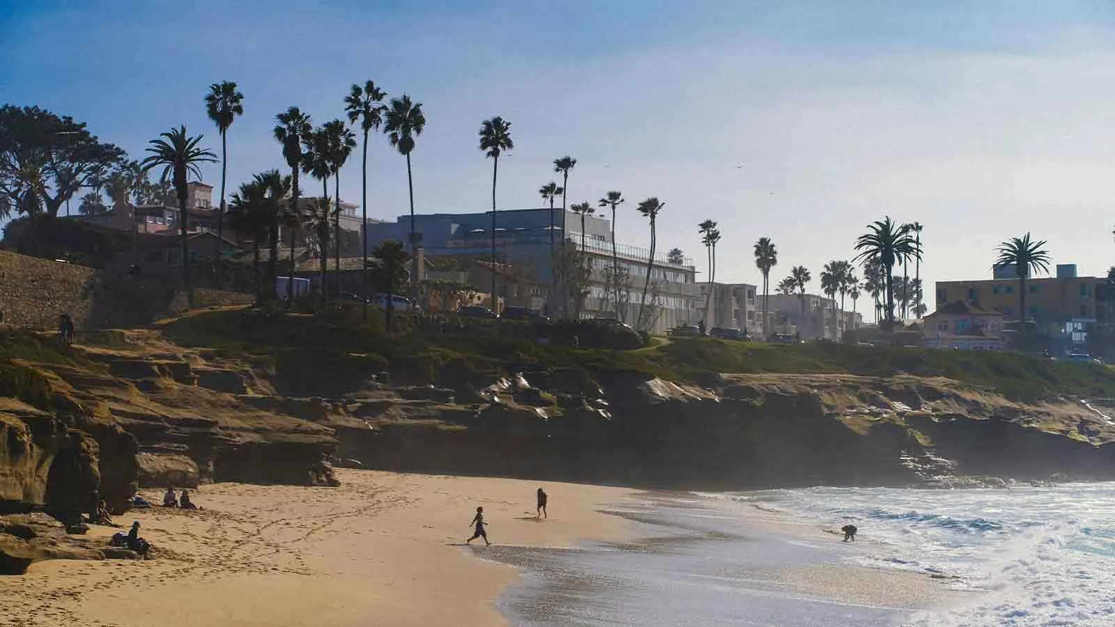 San Diego beach cove lined with properties served by lawyers title services