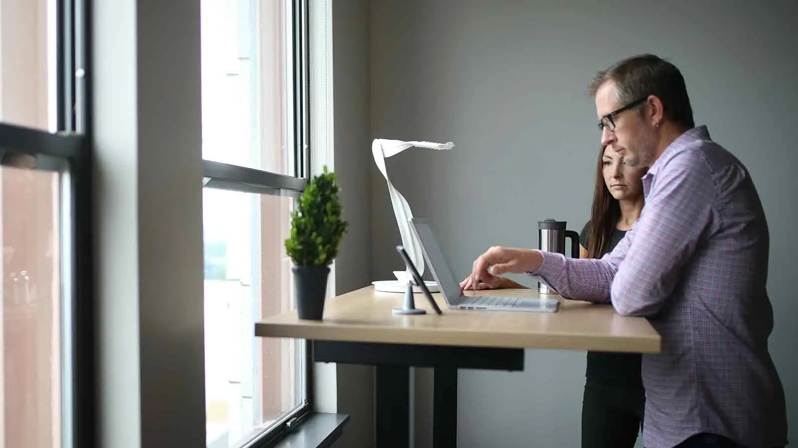 Buyers checking Pitkin County records online at a standing desk