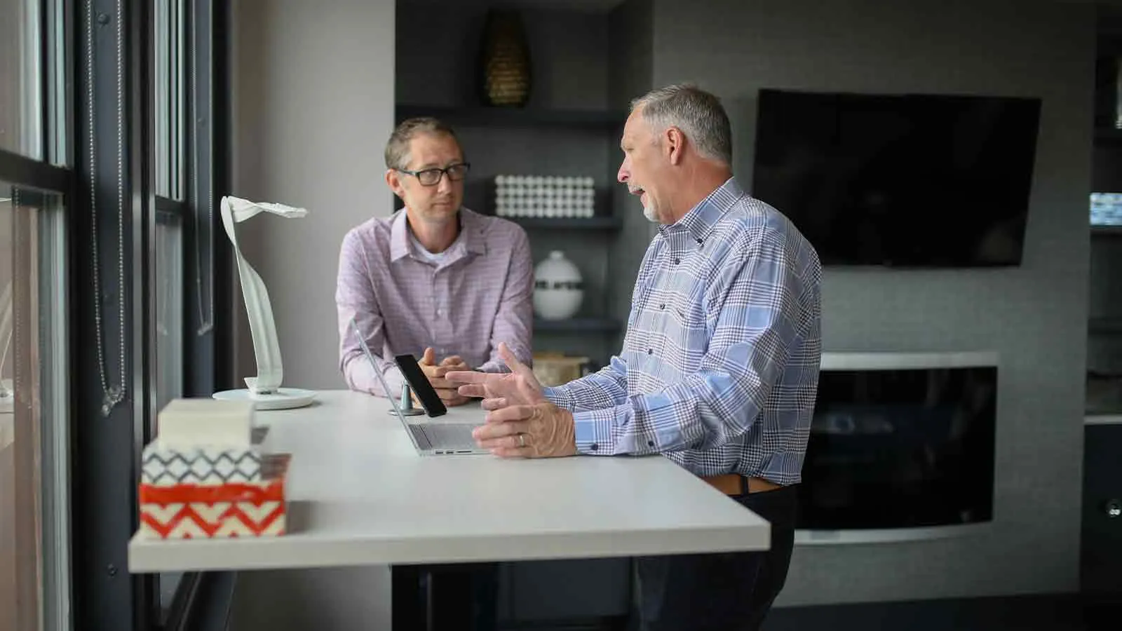 Homeowner and advisor confirming the payoff needed to remove a lien