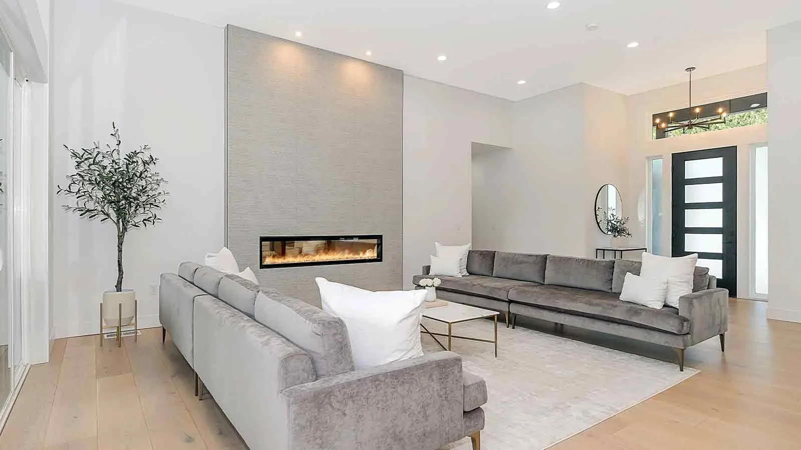 White living room with fireplace in a home governed by restrictive covenants