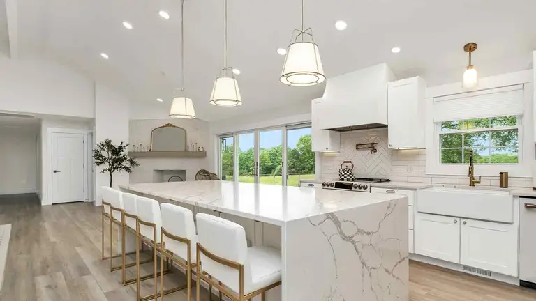 White kitchen of a home insured through carefully chosen title insurance providers