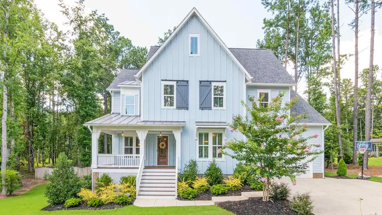 Pale-blue farmhouse whose closing depends on error-free title research