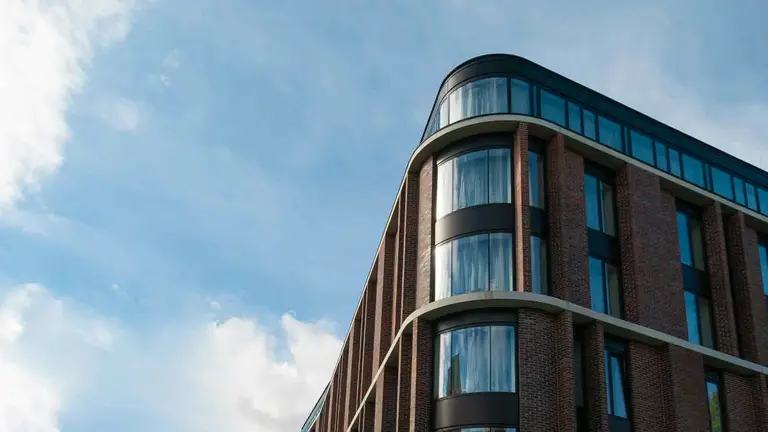 Curved brick and glass building housing a title resources guaranty company
