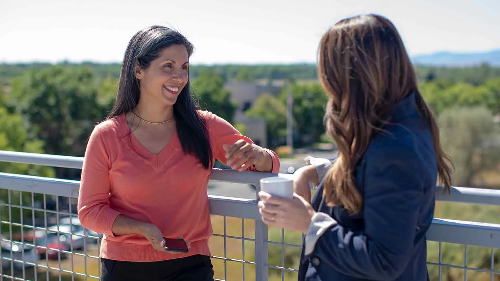 Homebuyers discussing what a title search covers before making an offer