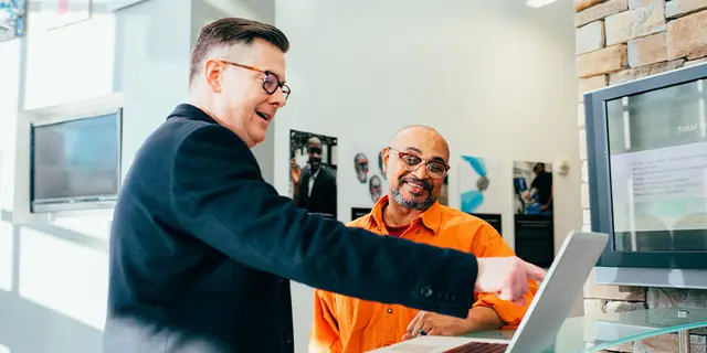Title search professionals reviewing property records together
